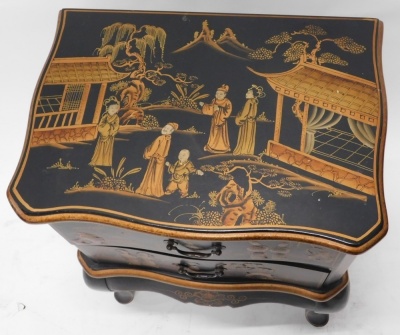 A Japanned lacquer finish side cabinet, with serpentine top, two drawers and cabriole legs, profusely decorated with figures, buildings, trees, and mountains, 68cm high, 49cm wide, 23cm deep. - 2