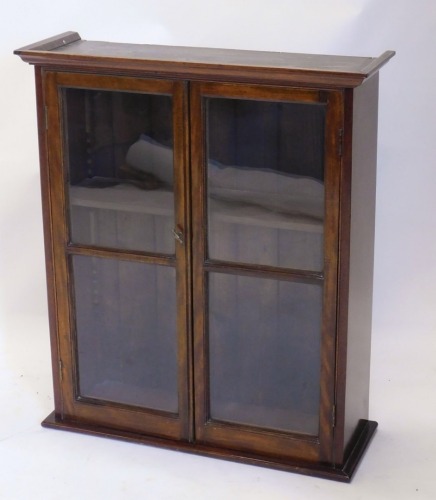 An early 20thC mahogany bookcase top, with panelled glazed front revealing shelf, 92cm high, 79cm wide, 27cm deep.