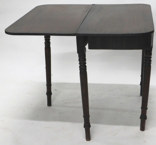 A 19thC mahogany fold over tea table, of D end form, on turned legs, when closed 73cm high, 93cm wide, 45cm deep.