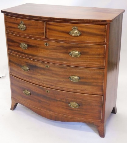 A 19thC mahogany bow front chest of two short and three long drawers, with oval brassed handles, on splayed feet, 100cm high, 98cm wide, 43cm deep.