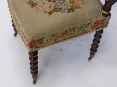 A 19thC rosewood and gilt highlighted prie dieu chair, heavily carved with a scroll back, turned supports, and overstuffed to the back and seat in petit point floral material, on turned legs terminating in castors, 119cm high. - 3