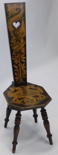 A pokerwork spinning chair, profusely decorated with dragons and scrolls, on turned legs, 99cm high.