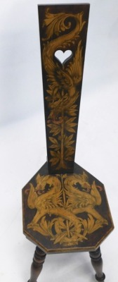 A pokerwork spinning chair, profusely decorated with dragons and scrolls, on turned legs, 99cm high. - 2