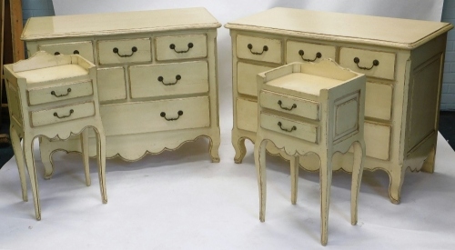 A rustic French bedroom suite, comprising two chests of three sized drawers, and two bedside cabinets, with galleried backs, 84cm high, 39cm wide, 32cm deep, each in cream.