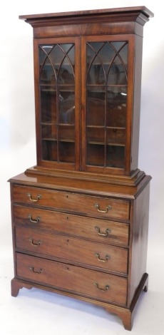 An early 19thC mahogany chest, of four long cock beaded drawers, on bracket feet, with an associated later mahogany bookcase top, with astragal glazing bars revealing three shelves, overall 195cm high, 89cm wide, 48cm deep.