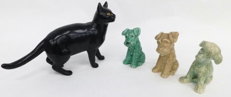 A 20thC Sylvac pottery standing black cat, 20cm high, and three various dogs, 1378, etc.(4)