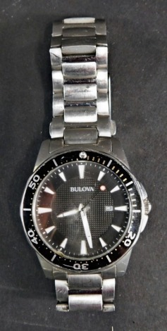 A Bulova wristwatch, in stainless steel case with black dial and date aperture, boxed.