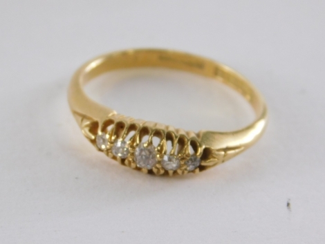 An 18ct gold diamond gypsy ring, set with five old cut diamonds, each in claw setting, ring size M½, 2.9g all in.