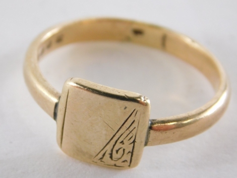 A 9ct gold signet ring, with square set panel, half engraved, on a plain band cut, ring size Q½, 3.3g.
