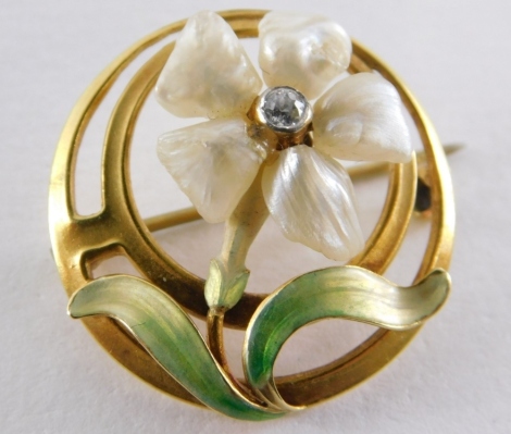 A diamond blister pearl and enamel circular brooch, the pierced design setting set with a white flower, with central diamond approximately 0.10 carats, in a yellow metal frame, unmarked, 2cm diameter, 4g all in.