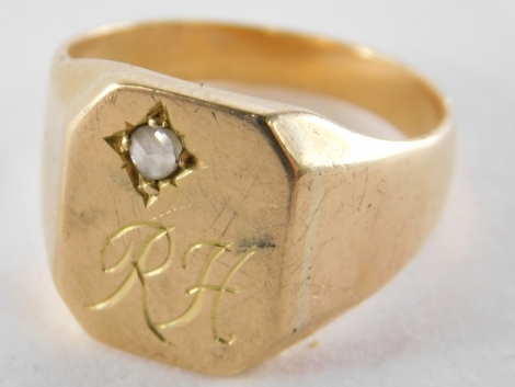 A signet ring, with octagonal panel, set with tiny diamond in illusion setting, bearing the initials RH, yellow metal, unmarked, believed to be 9ct gold, ring size U½, 13.3g all in.