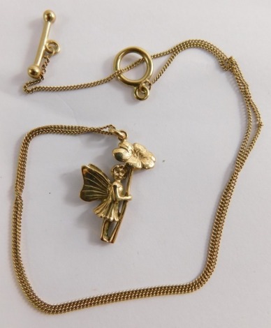 A 9ct gold fairy pendant and chain, the fairy holding flower, 2.5cm high, on a fine link neck chain, with large clasp, yellow metal unmarked, 40cm long, 4.4g all in.