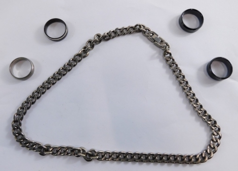 A group of silver jewellery, comprising curb link neck chain and four signet rings. (a quantity)