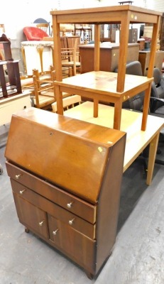 Two tile topped tables, and a bureau.