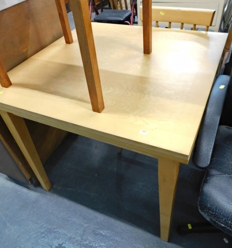 Dining table and a spindle back dining chair.