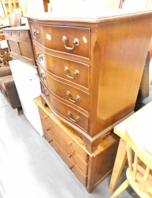 A serpentine chest of four long drawers, and an oak chest of three drawers.