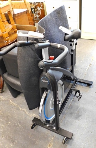 A JTX Fitness exercise bike and mat