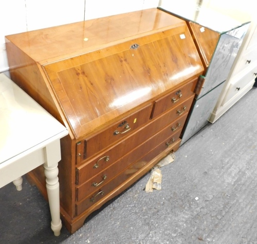 A yew wood finish bureau, and a pair of glazed boxes etched with flowers.