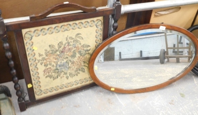 An oval mirror, and an oak fire screen.