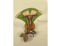 A modern Art Deco style table lamp in the form of two figures beside a stained glass fan