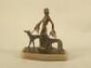 A cold painted bronze figure of a lady and two hounds in the Art Deco style