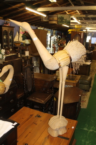 A large rush seated bird ornament.