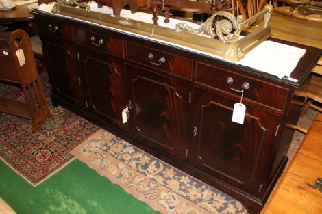 A modern four drawer sideboard.