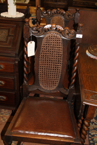 Four cane backed barley twist dining chairs.