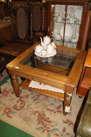 Pine two tier occasional table of Ducal type.