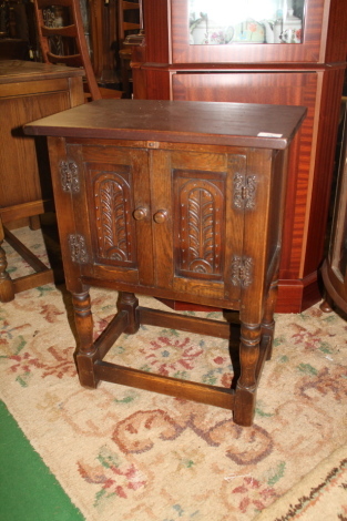 A small oak storage cupboard.