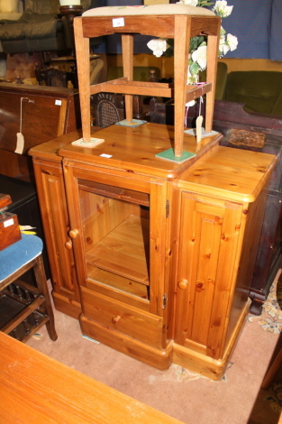 A modern Ducal pine break front Hi-Fi cabinet.