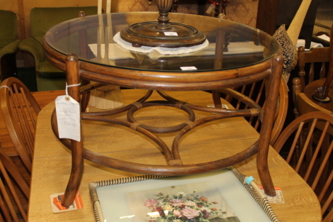 A circular cane coffee table.