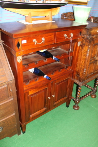 A mahogany reproduction wine rack.