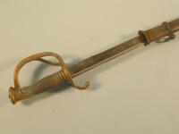 An early 20thC Cavalry sword with brass handle and iron scabbard