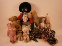 A toy leopard, a Dean's Child's Play Teddy Bear, a Golly, a pink Teddy, a toy dog etc