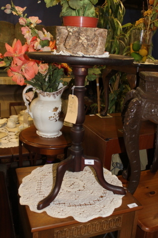 A 19thC tripod table.