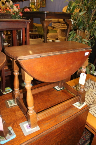 A small swivel drop leaf table.