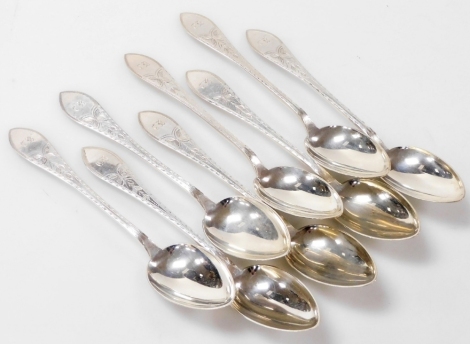 A set of eight Meyer Danish silver dessert spoons, foliate engraved, shield reserve monogram engraved, 9.20oz.