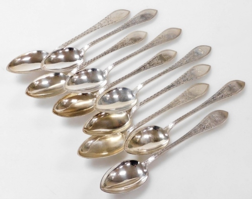 A set of ten Meyer Danish silver dessert spoons, foliate engraved, shield reserve monogram engraved, 12.68oz.