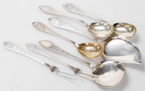 A group of Meyer Danish silver table flatware, foliate engraved, shield reserve monogram engraved, comprising a sugar sifting spoon, two fruit spoons, a pair of pickle forks, and two cake or meat slices, 8.07oz.