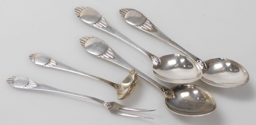 Five items of Meyer & Christian Heise Danish silver tableware, each handle cast with a roundel and line decoration, comprising three tablespoons, a pickle fork, and a cream ladle, 5.61oz.