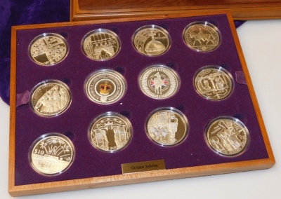 A Royal Mint Elizabeth II Golden Jubilee silver proof coin collection, the fitted case containing twenty four silver coins with the Queen's portrait highlighted in 22ct gold, no. 2994, sold with certificates and presentation booklet, with purple velvet dr - 2