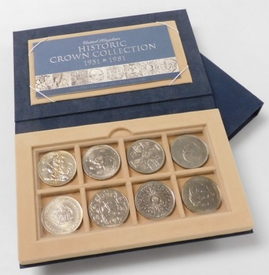 A Royal Mint Historic Crown Collection 1951-1981, the fitted case containing eight commemorative crowns, with paperwork, sleeve and outer cardboard packaging.