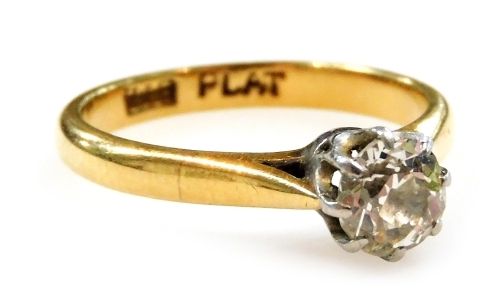 An 18ct gold platinum and diamond solitaire ring, high claw set, approx 0.6ct, size L, 2.8g.