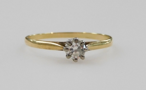 A diamond solitaire ring, in a high claw setting, in yellow metal stamped 18ct, approximately 0.25ct, size N/O, 1.2g.