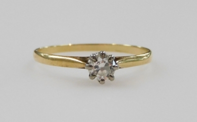 A diamond solitaire ring, in a high claw setting, in yellow metal stamped 18ct, approximately 0.25ct, size N/O, 1.2g.