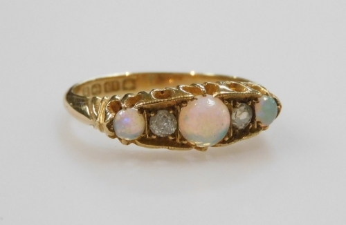 An 18ct gold opal and diamond five stone ring, in a claw setting, size O, 3.4g.