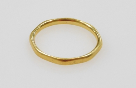 A 22ct gold wedding band, of octagonal form, size M/N, 2.2g.