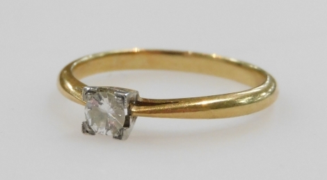 An Art Deco diamond solitaire ring, in a square claw setting, in yellow and white metal, stamped 18ct and platinum, approximately ¼ct, size N, 2.3g.