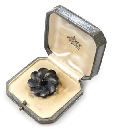 A late 19thC German black floral brooch, possibly jet, set in white metal, in a fitted box, for the Court Jeweller Gebr Friedlaender, Hof-Juweliere to Their Majesties The Kaiser and Kiserin, Berlin.